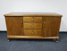 A continental oak sideboard fitted three drawers