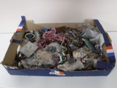 A box of costume and fashion jewellery - earrings,