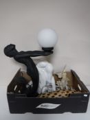 A box containing contemporary figured table lamp with shade, a mermaid table lamp with shade,