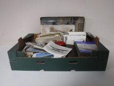A box containing a large quantity of postcards,