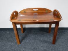 A mahogany butlers tray on stand
