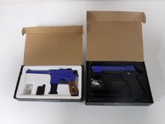 Two boxed Airsoft guns
