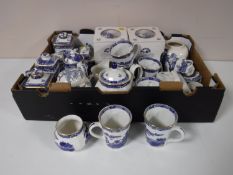 A box containing a quantity of Ringtons willow pattern china