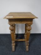 An early twentieth century oak occasional table,