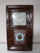 A mahogany cased American eight day wall clock