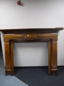 An early 20th century oak fire surround