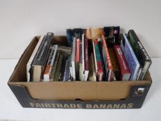 Two boxes of books relating to photography,