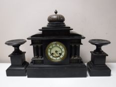 A Victorian slate mantel clock garniture