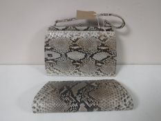 A snakeskin handbag and evening bag
