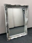 A silvered framed Victorian style over mantel mirror