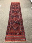 A Meshwani runner on blue ground,