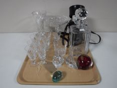 A tray of crystal decanter, crystal comport, paperweights,