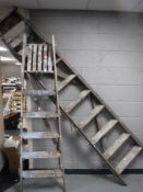 Two wooden folding ladders