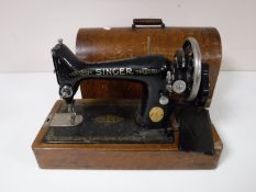 A Singer sewing machine in box,