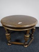 An oak circular occasional table
