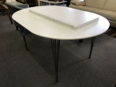 A mid 20th century white extending table and two leaves CONDITION REPORT: Some