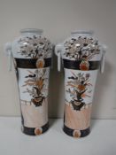 A pair of Imari style twin handled baluster vases