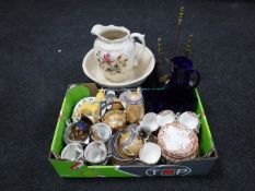 An antique china jug and basin together with a brass fire companion set and a box containing tea