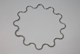An 18ct white gold diamond necklace, 31.5g, approximately 3ct.