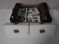 A box containing Atlas edition trams,