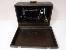 A Singer sewing machine in box