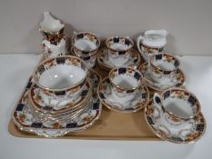 A tray of Edwardian tea china