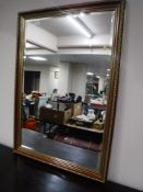 An antique style bevelled mirror