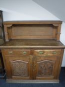 A Victorian oak sideboard with buffet back