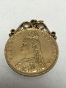 A mounted silver-gilt four shilling coin pendant