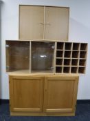 A beech office storage cabinet in three sections,