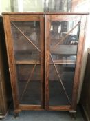 Two oak display cabinets