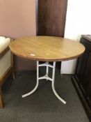 A heavy metal cafe table with oak table