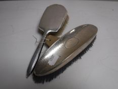 Two silver dressing table brushes