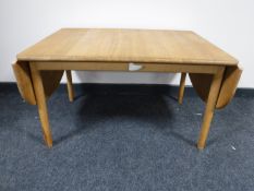 An oak low table with drop sides