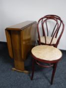 A walnut gate leg table and two Bentwood chairs