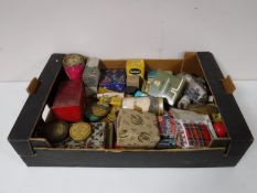 A box containing vintage ointments, old advertising boxes,