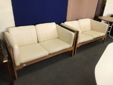 A pair of oak framed two seater settees