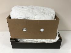 A box containing a large quilt,