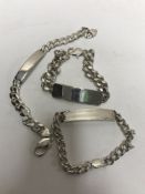 Three silver identity bracelets,