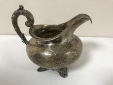 A silver milk jug