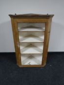 A Victorian pine corner cabinet