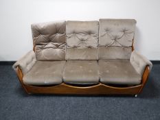 A mid twentieth century teak framed three piece lounge suite