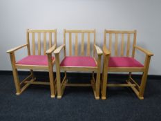 A set of eleven beech framed armchairs