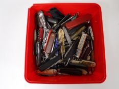 A box of a large quantity of pocket knives