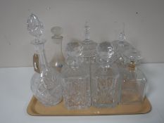 A tray of crystal decanters,
