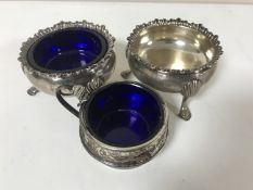 A pair of Georgian silver salts together with one further silver salt with blue glass liner