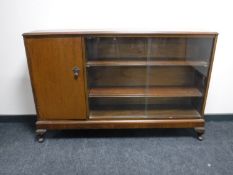 A mahogany sliding glazed door bookcase