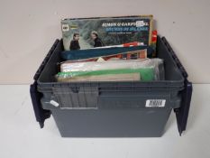 A box containing LP's, vintage songbook,