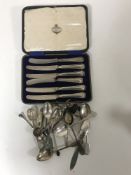 A set of six silver handled butter knives together with various silver teaspoons,