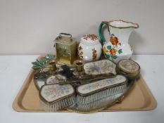 A tray of needlepoint dressing table set, carriage clock, Maling jug,